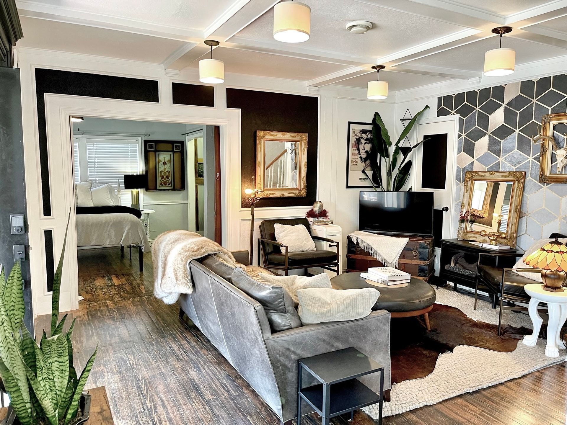 A living room filled with furniture and a television.