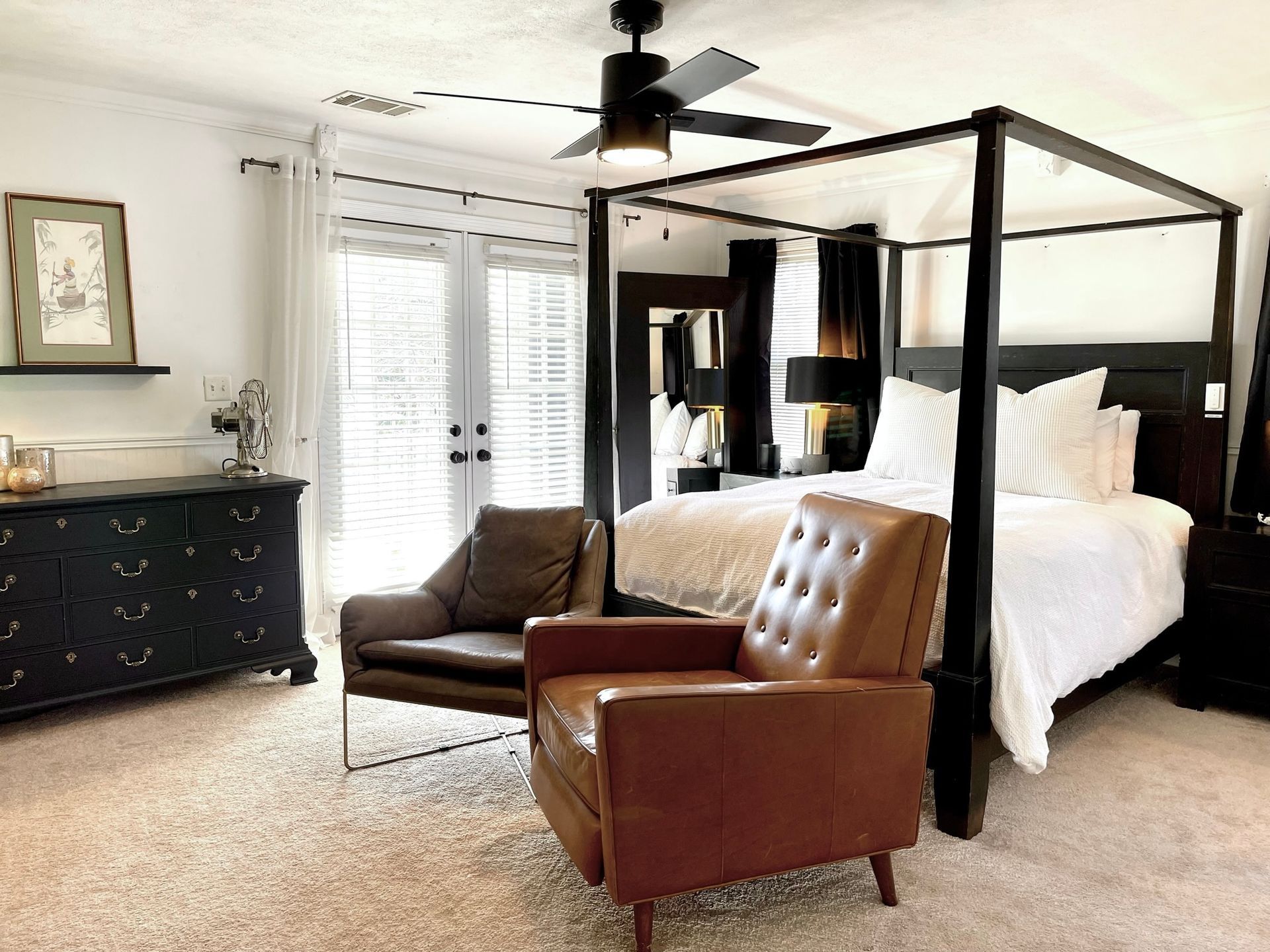 There is a four poster bed in the middle of the room.