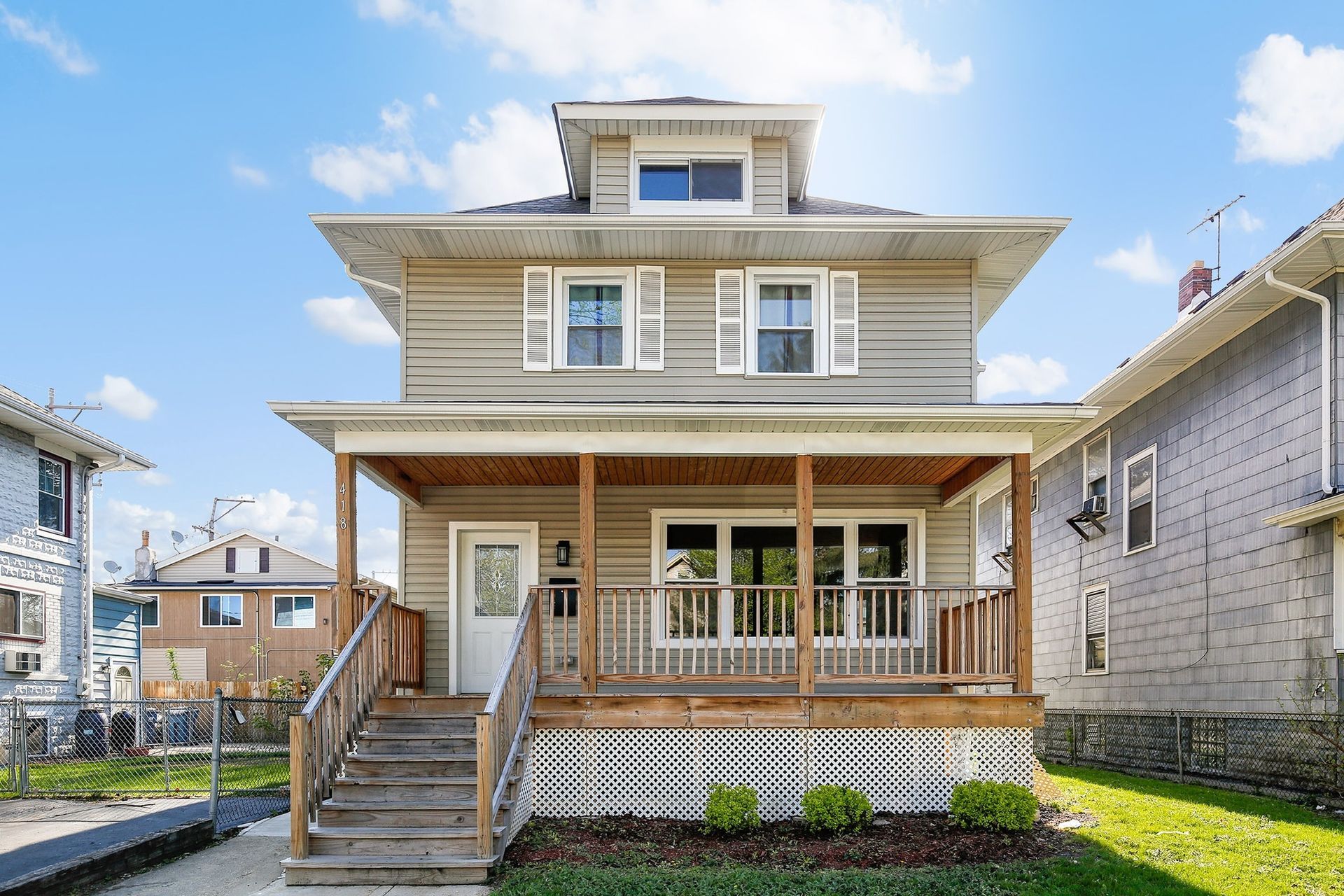 A house with a porch and stairs leading up to it