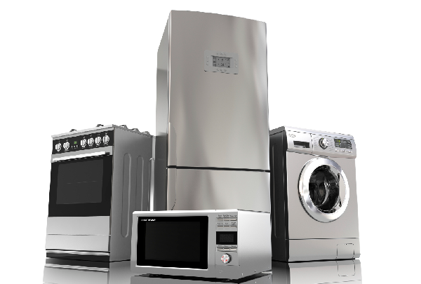 Un grupo de electrodomésticos de acero inoxidable que incluye frigorífico, microondas, lavadora y horno.