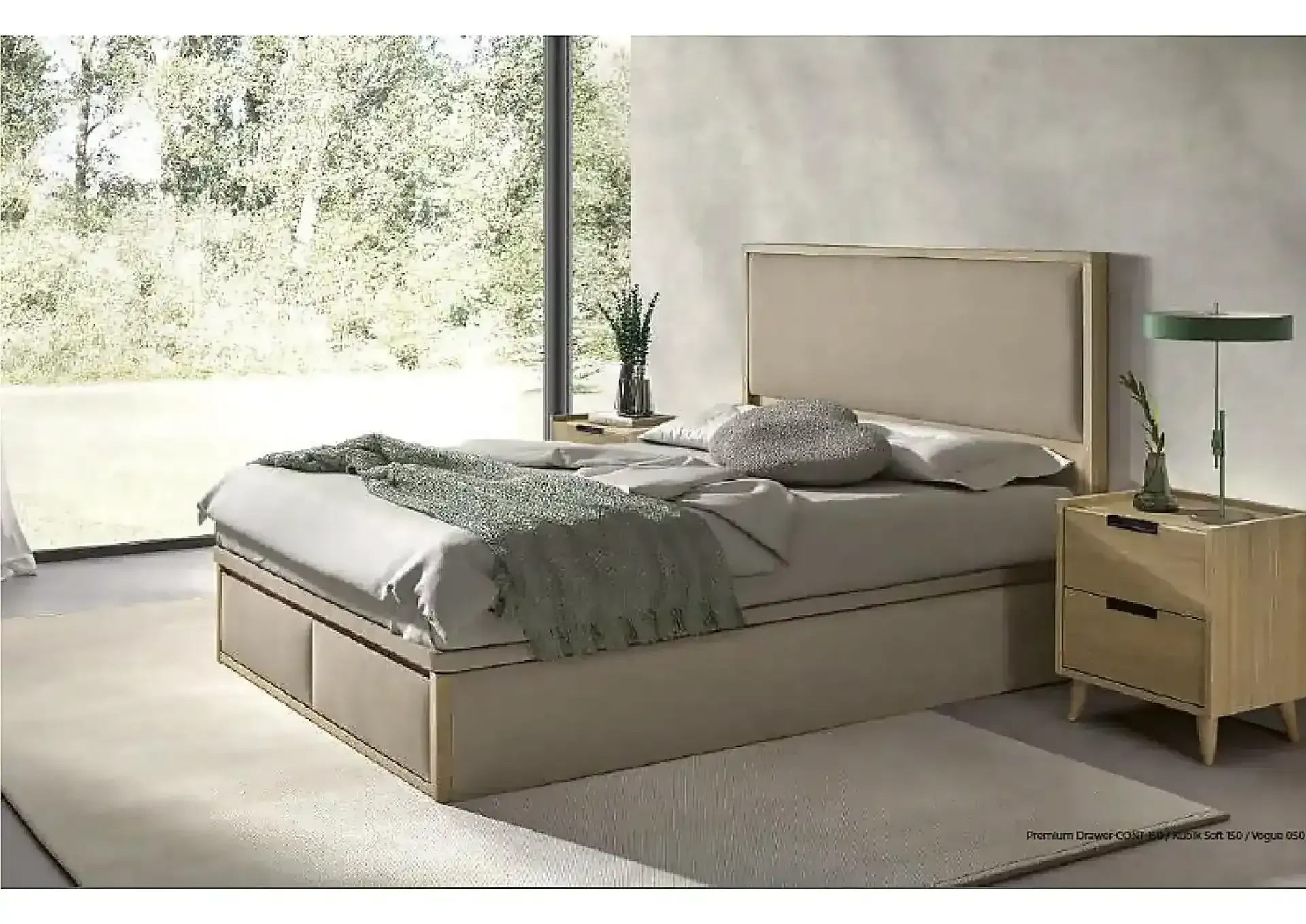 Dormitorio moderno con cama tapizada en gris, colchón blanco, almohadas negras y una manta oscura.