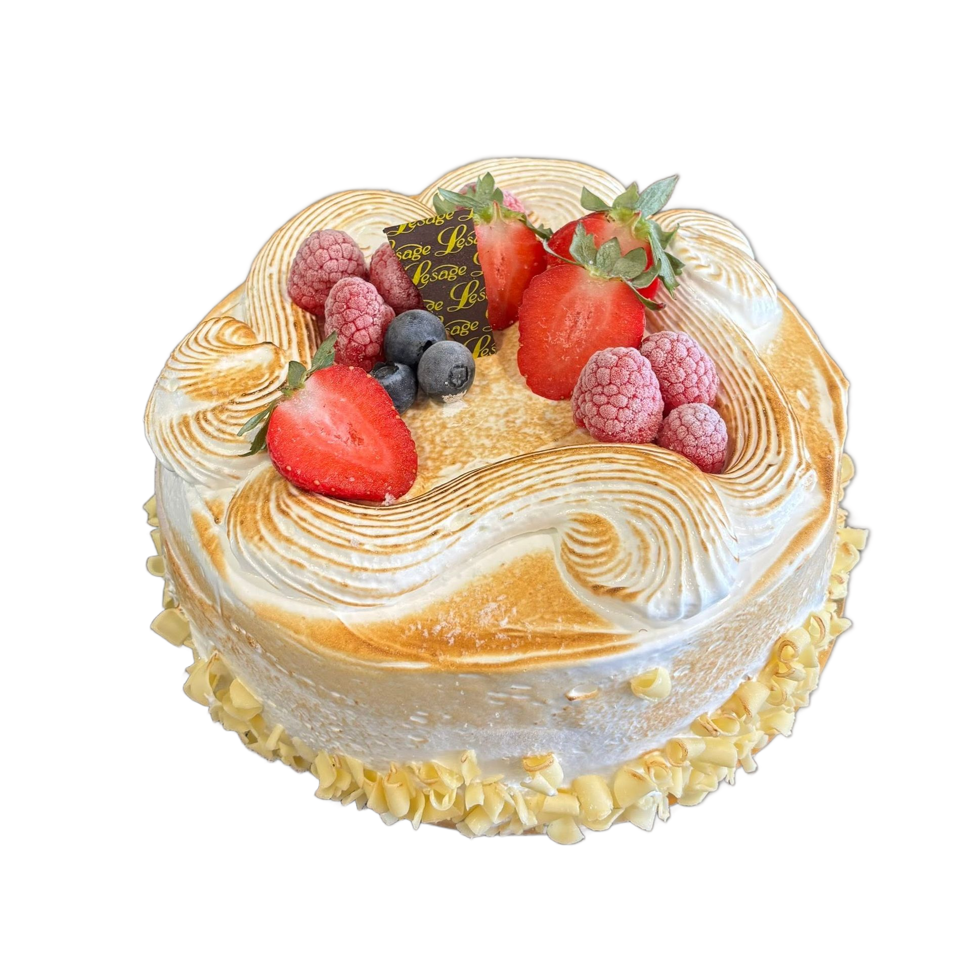 Gâteau rond couvert de meringue et de fruits.
