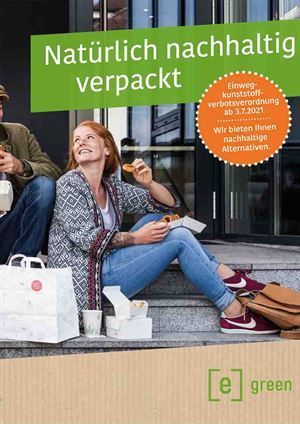 Ein Mann und eine Frau sitzen auf den Stufen eines Gebäudes und essen.