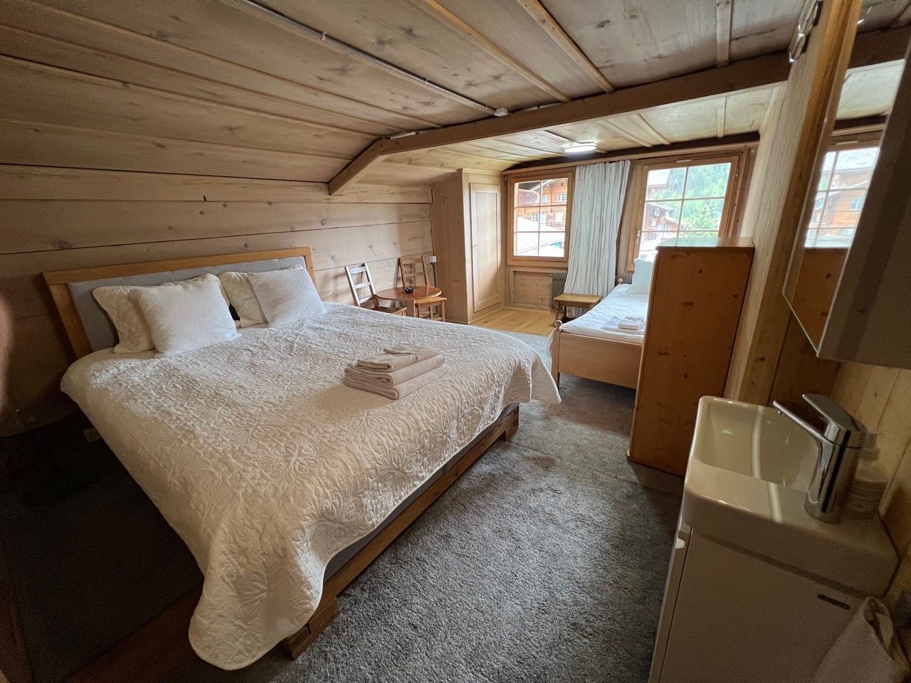 There is a large bed in the middle of the room.