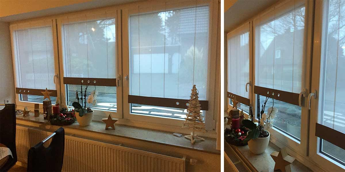ein Fenster mit weißen Vorhängen und einem Weihnachtsbaum darauf