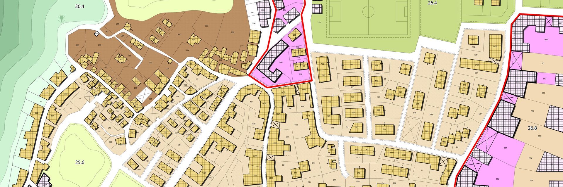 Carte d'une ville montrant les routes et les bâtiments avec des zones codées par couleur.