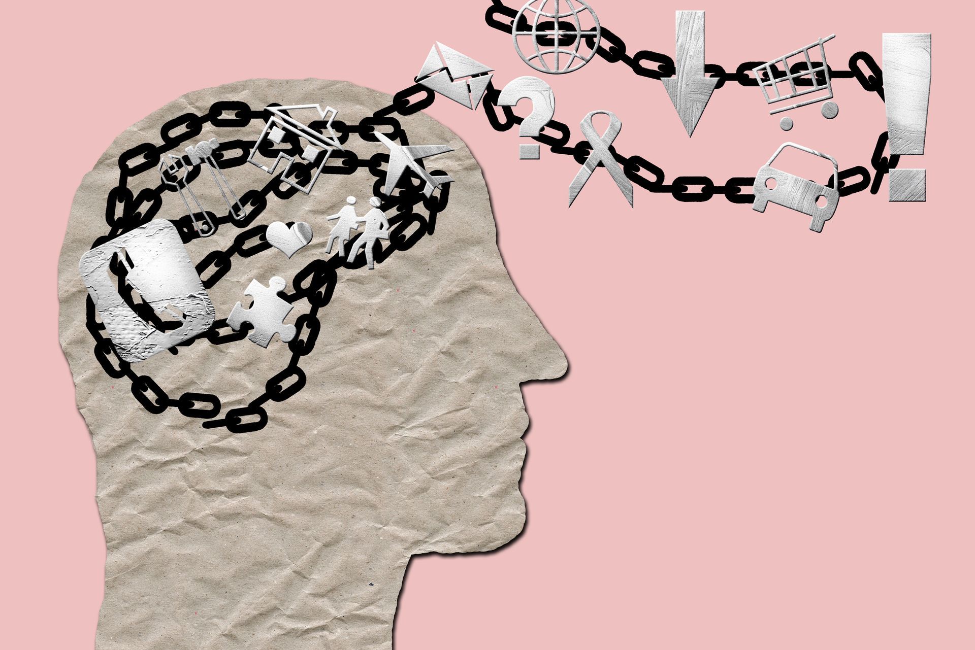 Des chaînes sortent d'un visage en papier