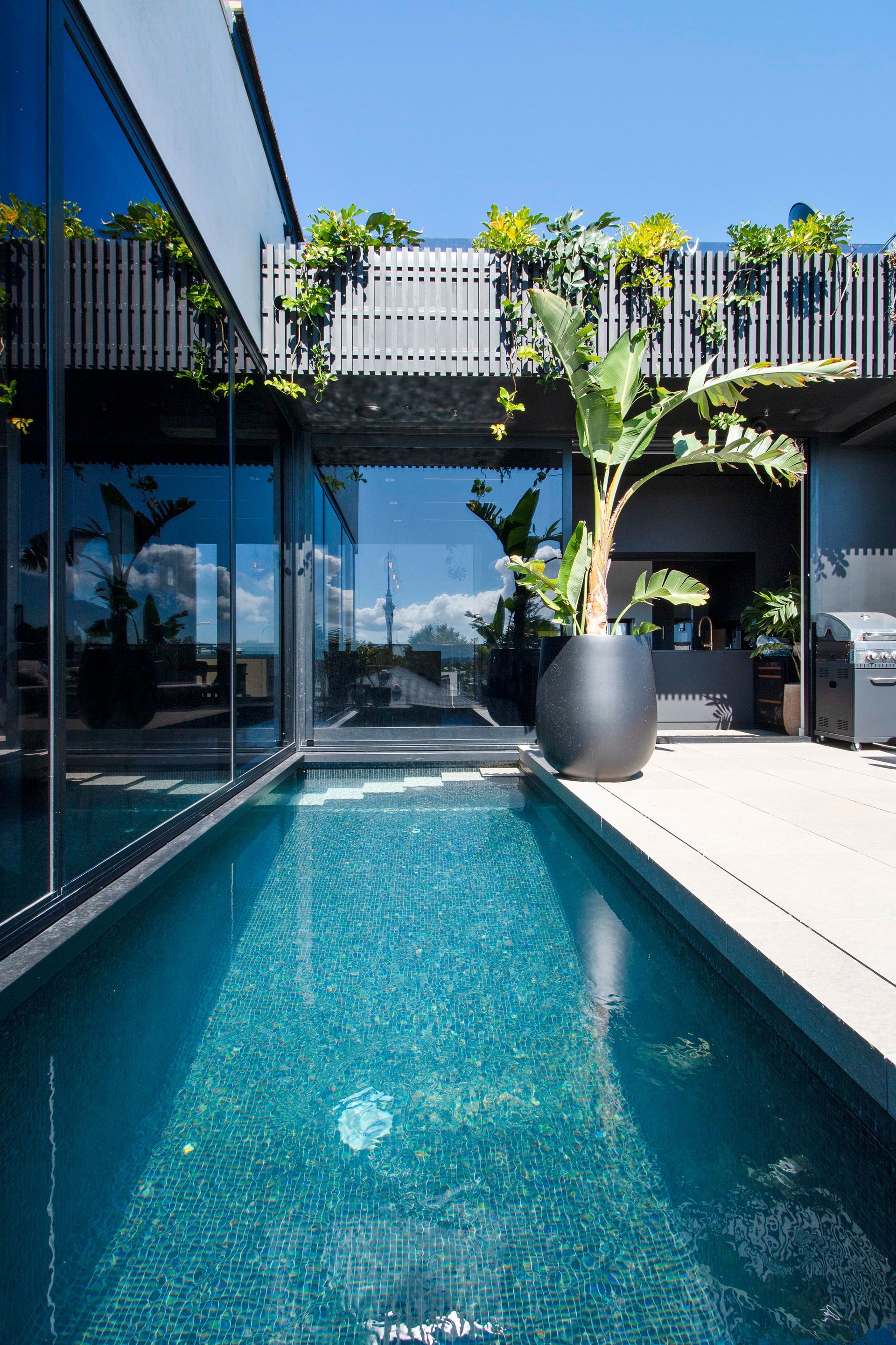 Enjoy the upper half of the six level building boasting  9 person spa, putting green and training pool