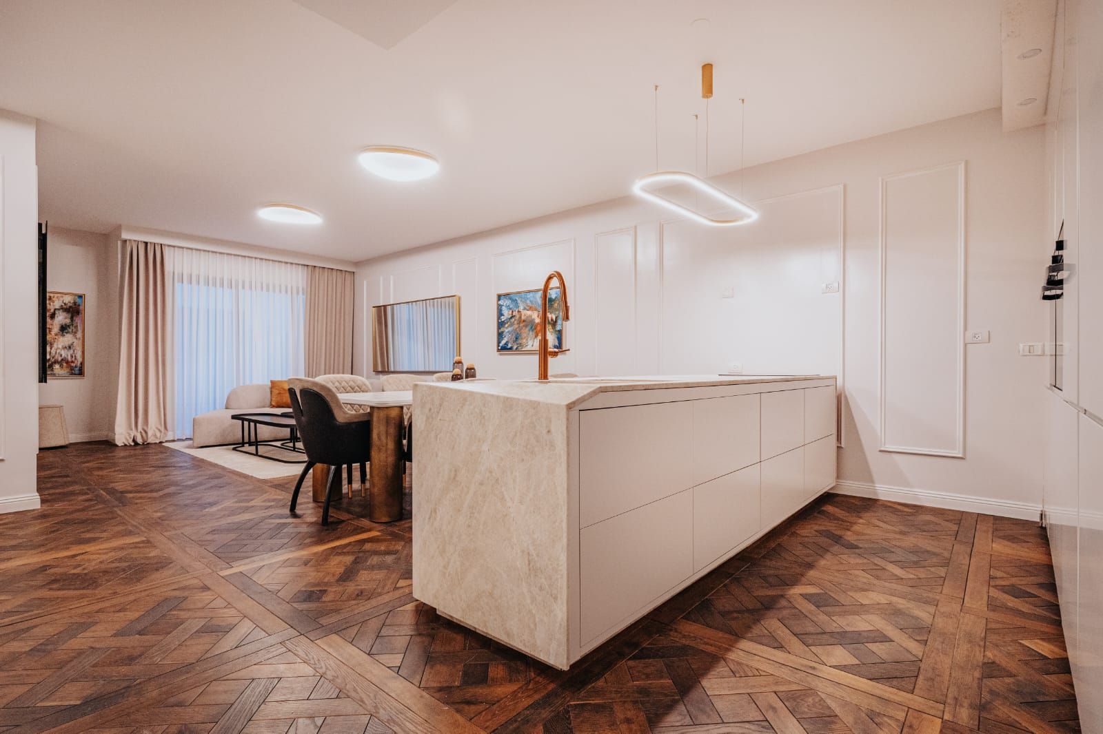 A kosher kitchen with a large island in the middle of the room in an airbnb in Jerusalem