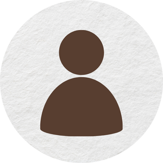 A brown icon of a person in a white circle.