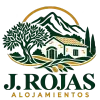 Logotipo para J. Rojas Alojamentos con una casa verde, un árbol, montañas y detalles dorados
