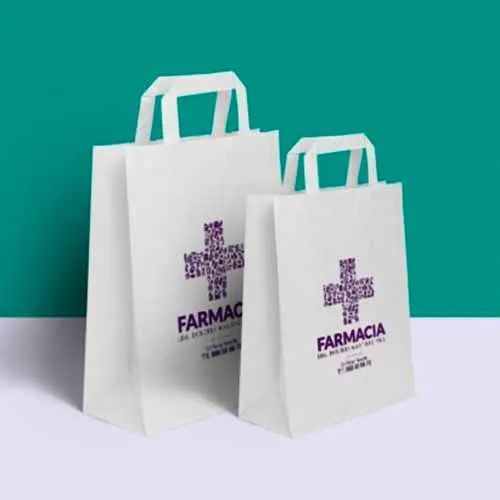 Una bolsa de papel blanca con la palabra farmacia escrita en ella.