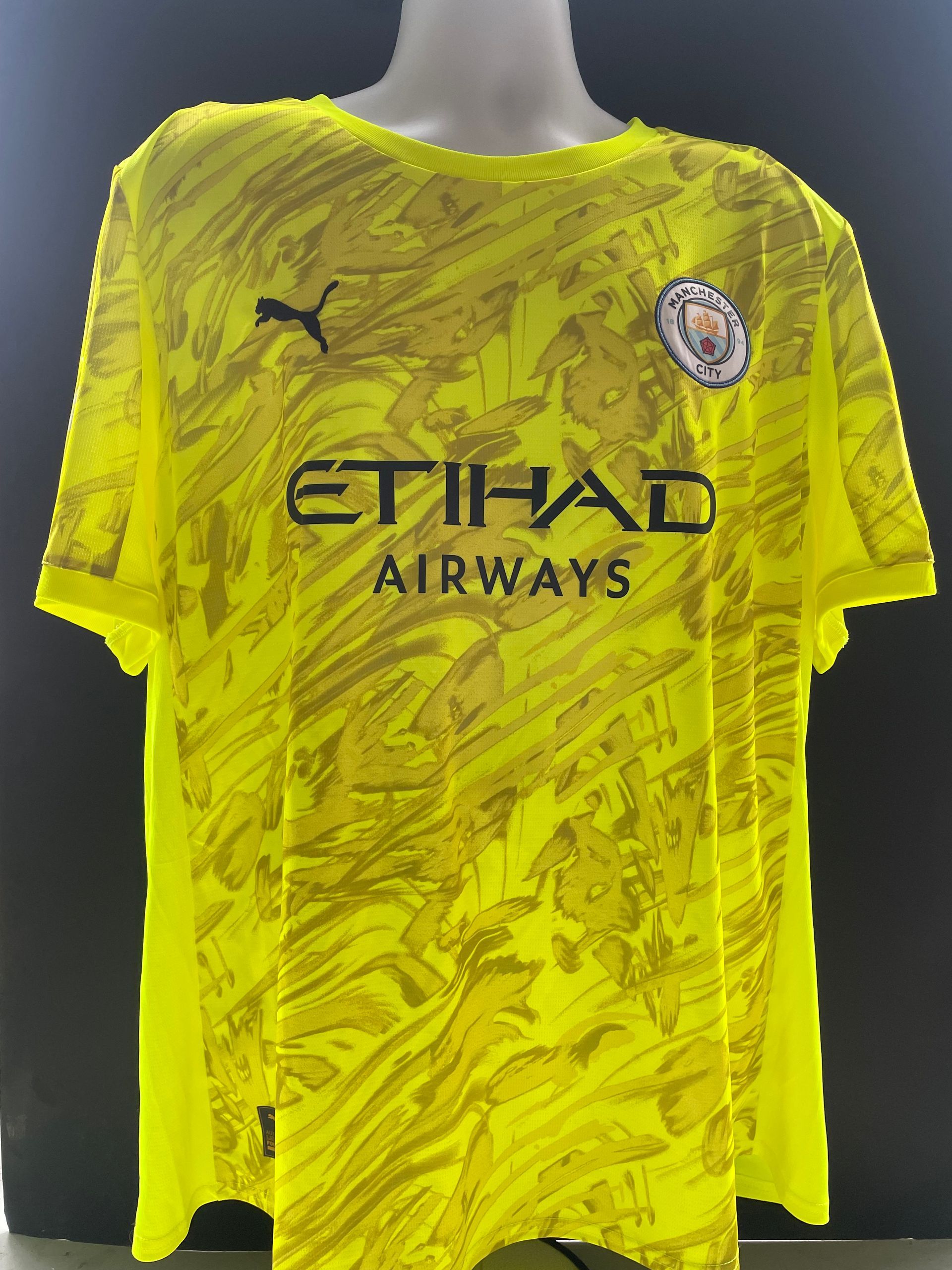 Bright yellow soccer jersey with “Donnarumma” and number 25 on the back