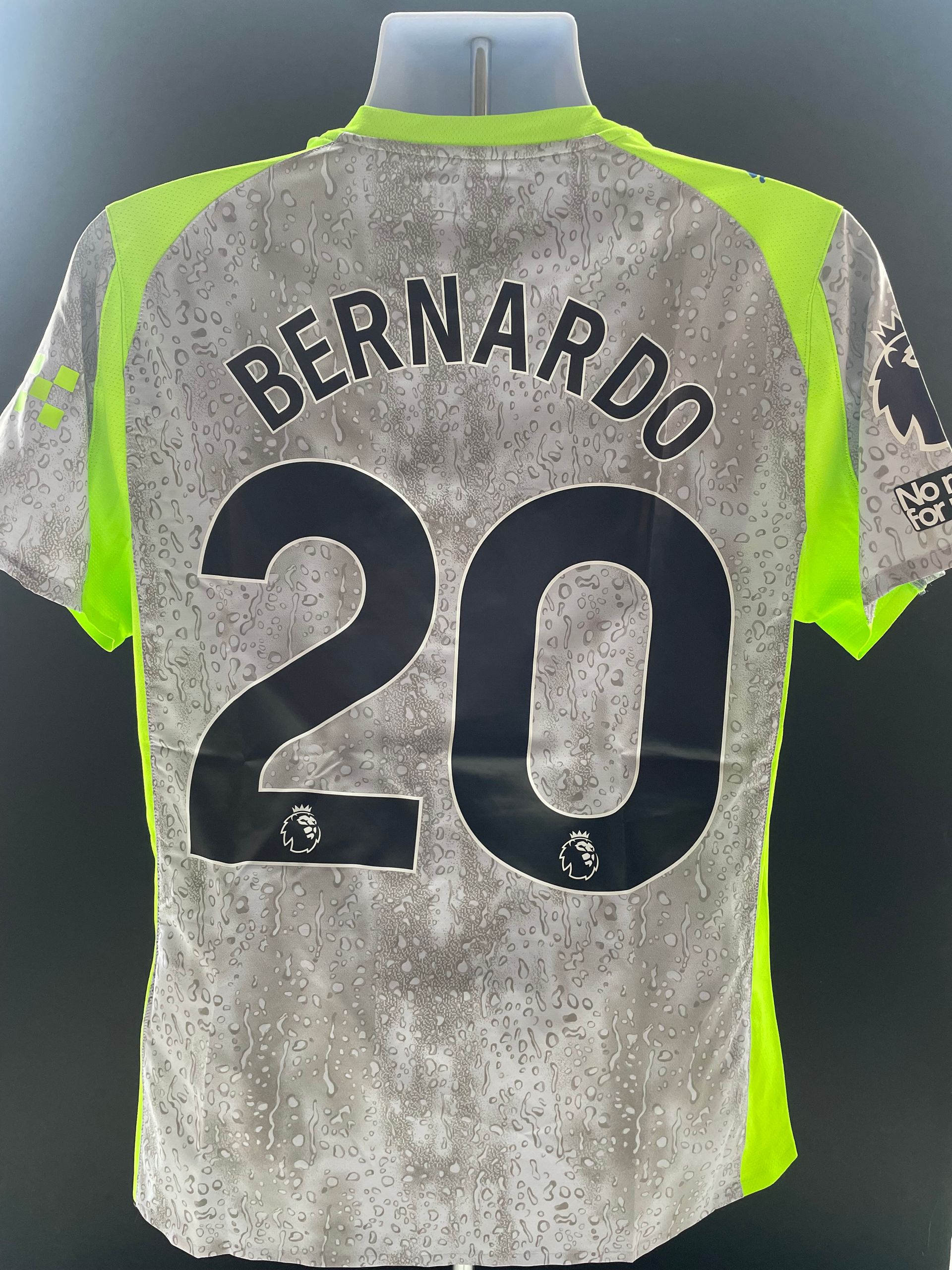 Gray soccer jersey with neon green accents, “BERNARDO” and number 20 on the back.