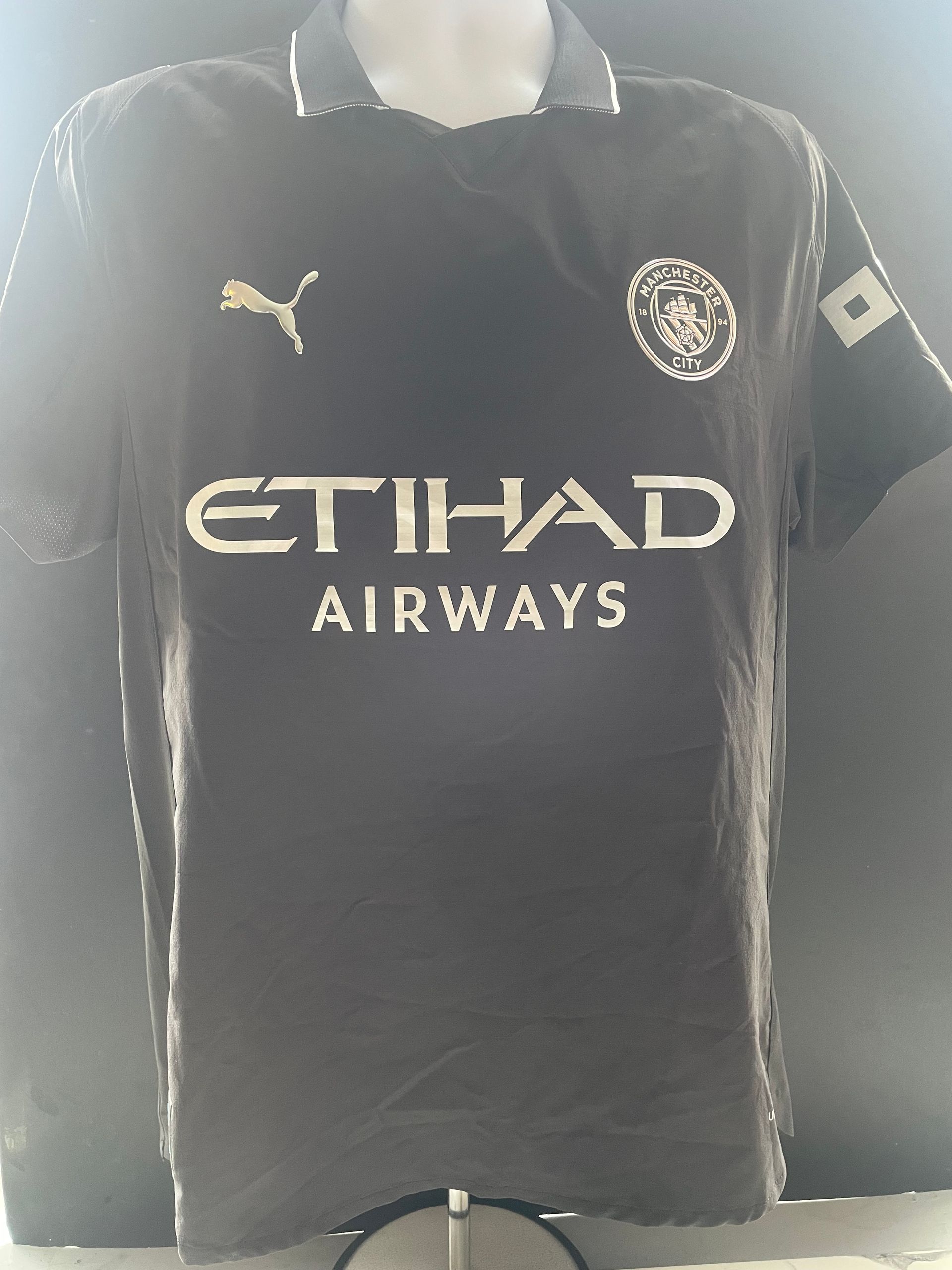 Black sports jersey with white “SEMENYO” and number 42 on the back
