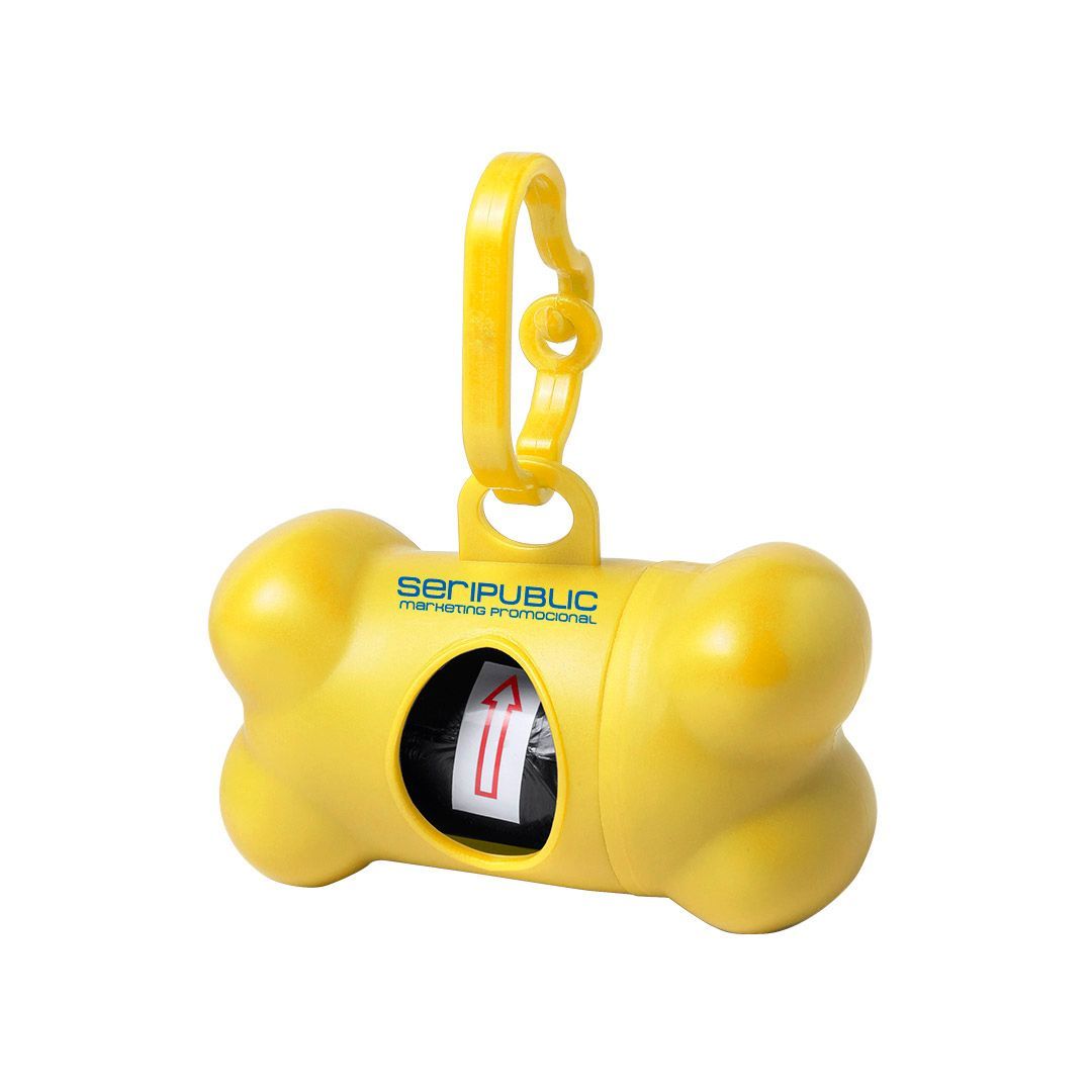 Dispensador de bolsas para desechos de perros en forma de hueso de color amarillo, con clip y que contiene un rollo de bolsas; se ve la palabra