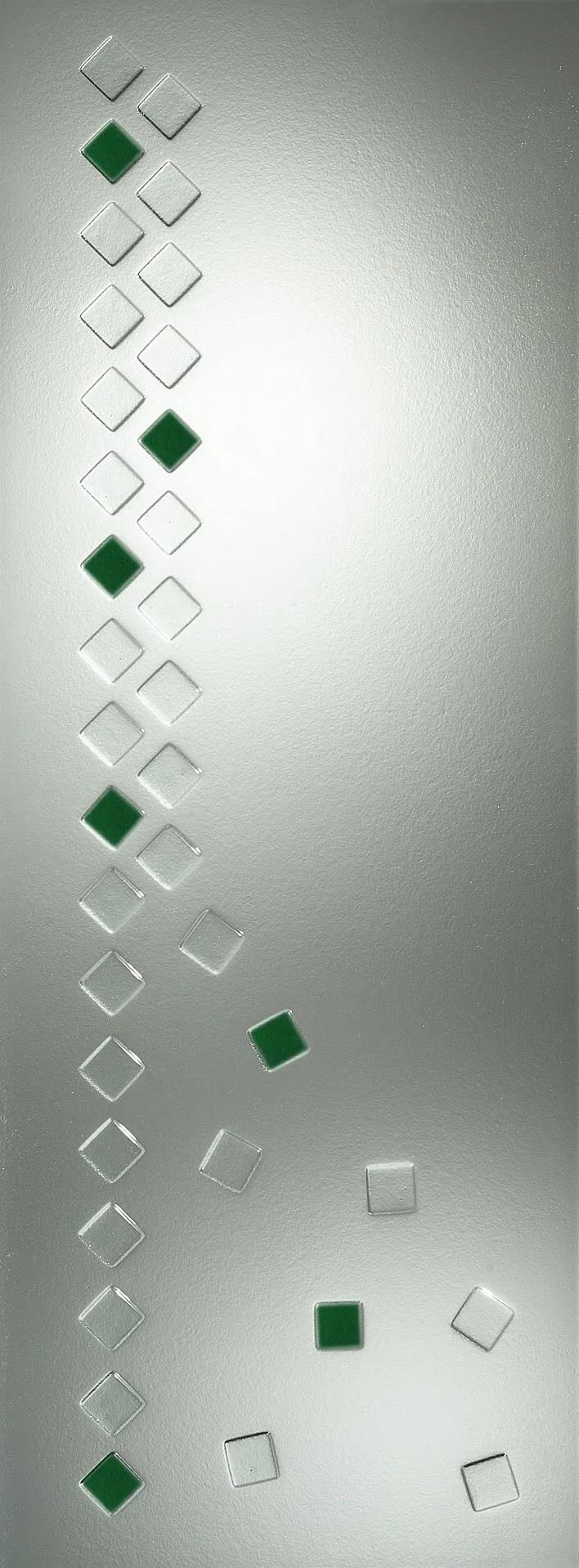 Eine Nahaufnahme einer Glastür mit grünen Quadraten darauf