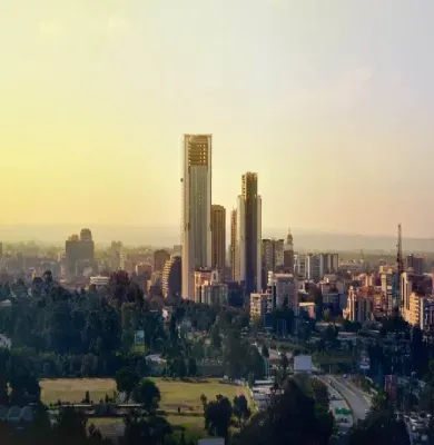 An aerial view of a city skyline at sunset.
