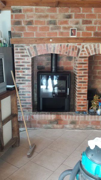 Poêle à bois ave porte vitrée