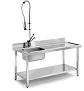 Una mesa de acero inoxidable con fregadero y grifo.