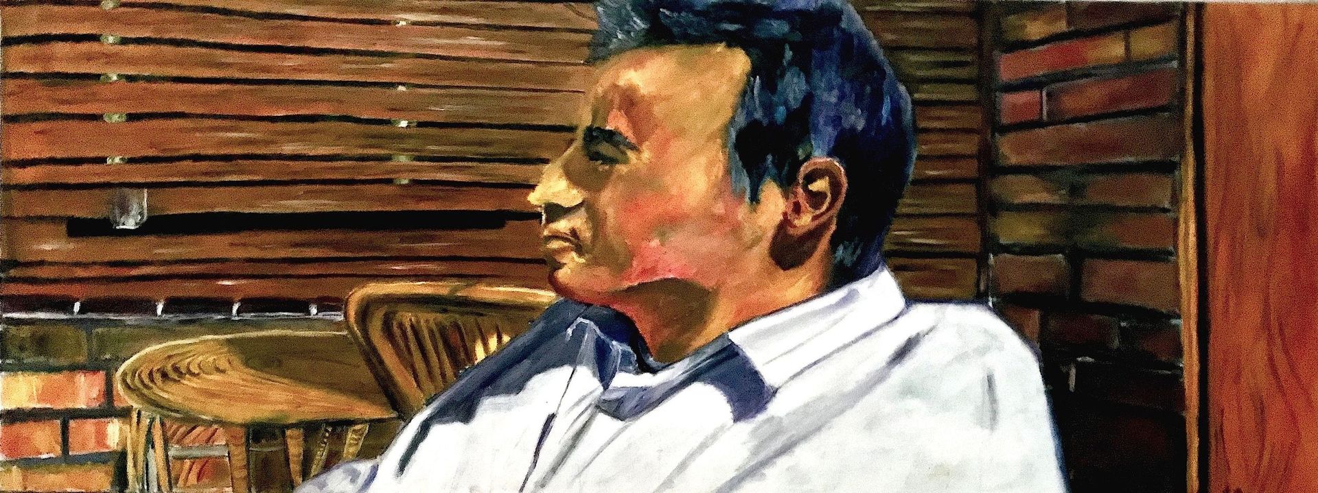 Un cuadro de un hombre sentado en una silla frente a una pared de ladrillos.