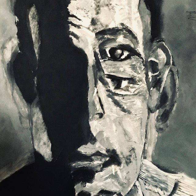 Una pintura en blanco y negro del rostro de un hombre.