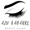 Un logotipo para un salón de belleza con un primer plano del ojo de una mujer con pestañas largas.
