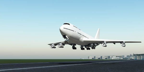 Un gran avión blanco está despegando de la pista de un aeropuerto.
