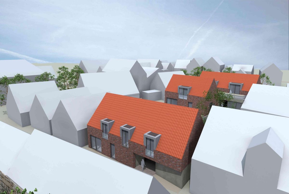 Eine Luftaufnahme einer kleinen Stadt mit roten Dächern