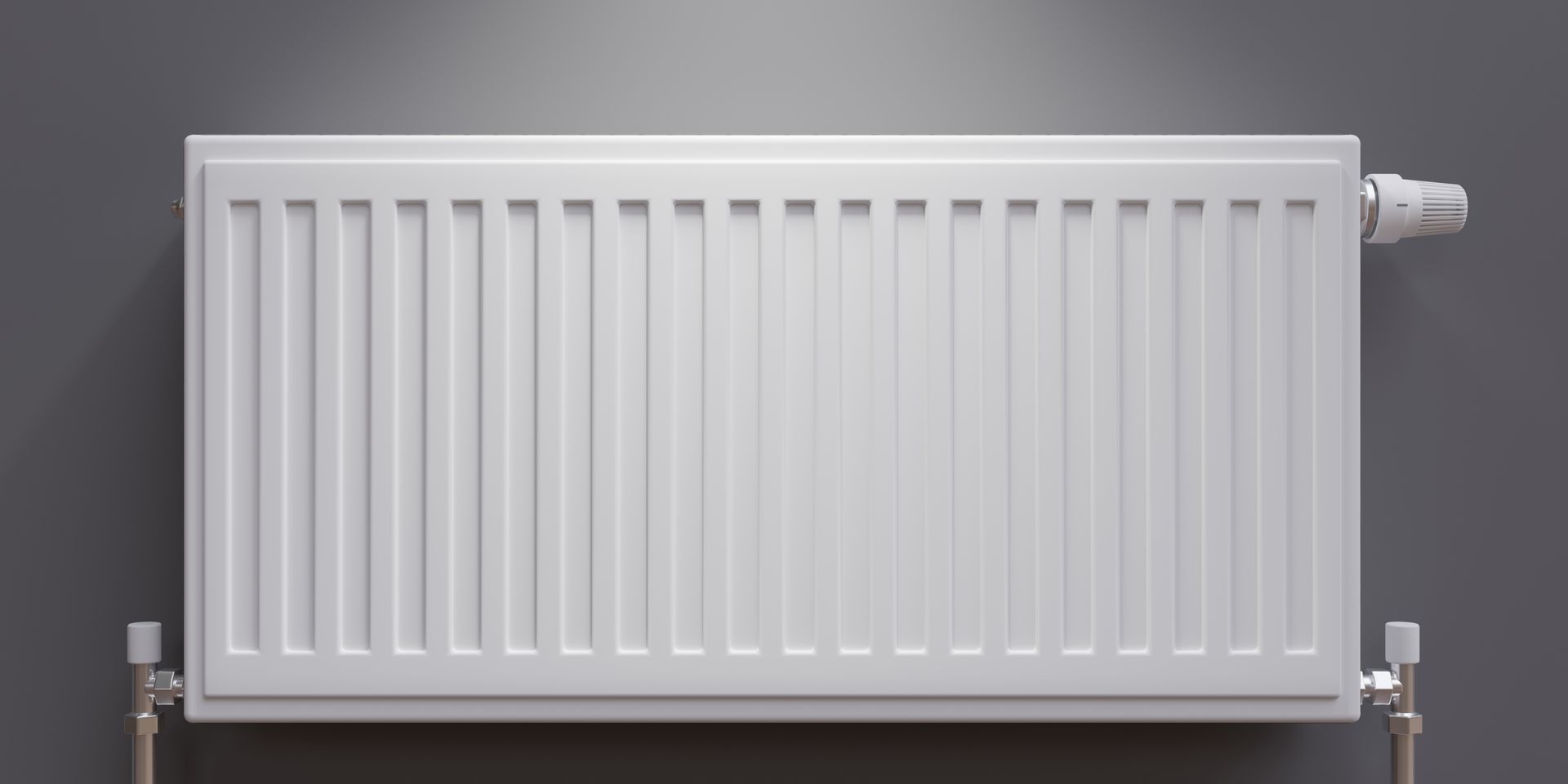 Radiateur à eau blanc sur un mur gris