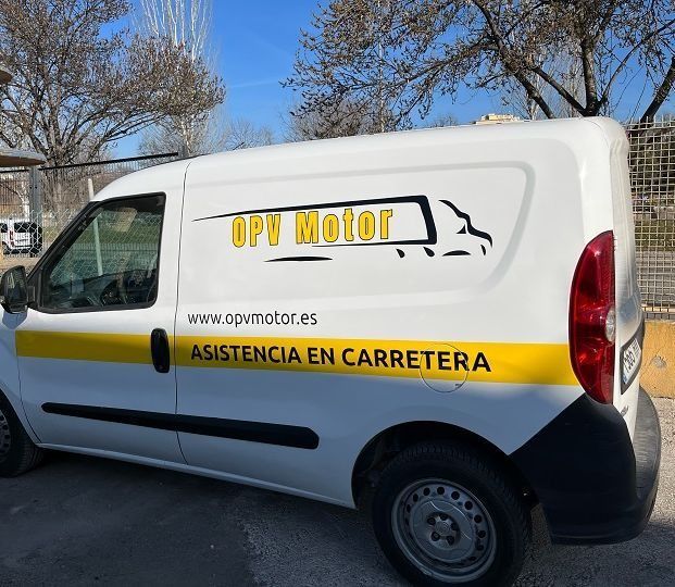 Una camioneta blanca con la palabra ups motor en el costado