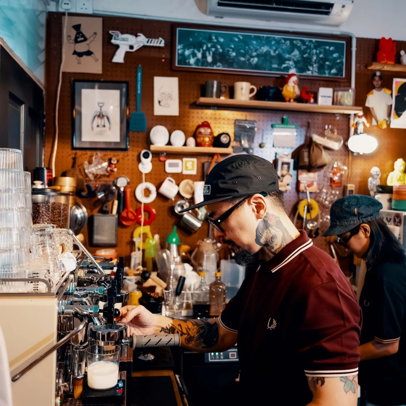 Barista at Piu Piu Piu KL — quirky Japanese pop culture cafe inside Zhongshan Building Kuala Lumpur