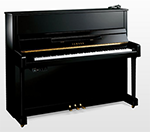 Ein schwarzes Klavier steht auf einer weißen Fläche.