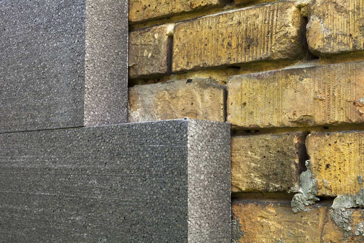 Isolation d'un mur en pierre par l'extérieur.