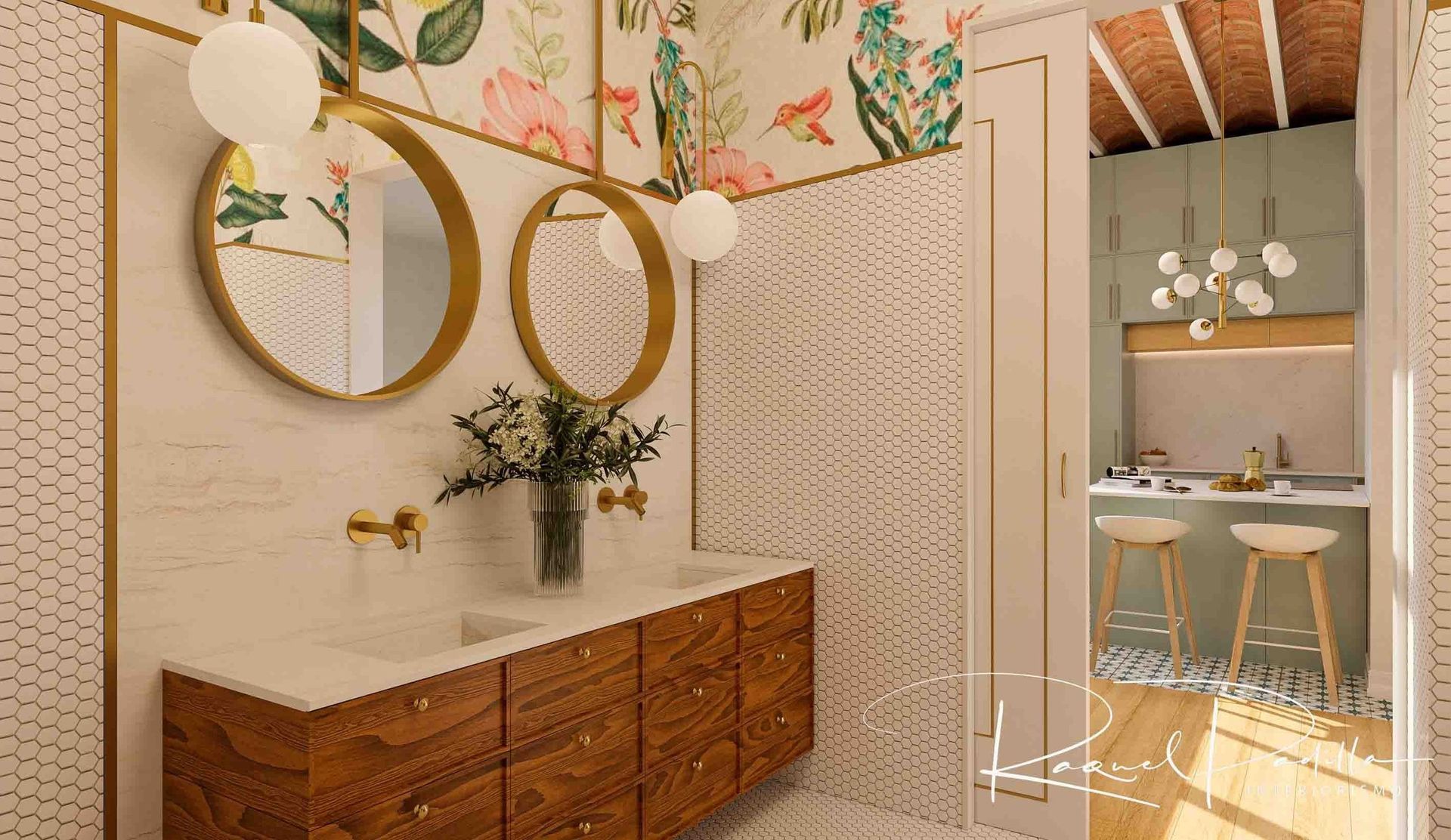Baño con papel tapiz floral, detalles dorados y tocador de madera, que conduce a una cocina con taburetes.