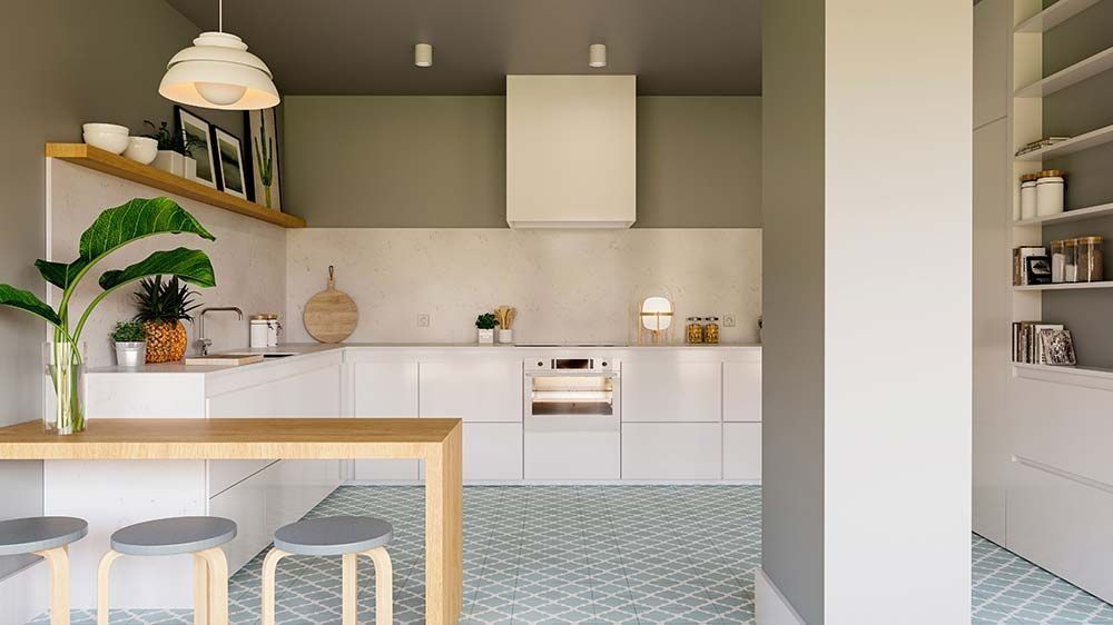 Cocina moderna con gabinetes blancos, isla de madera y pisos de baldosas verdes.