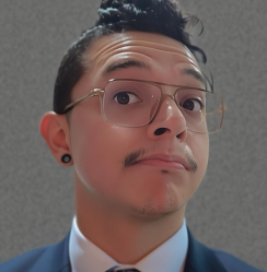 Man with glasses and a mustache, looking up with a slight smirk.