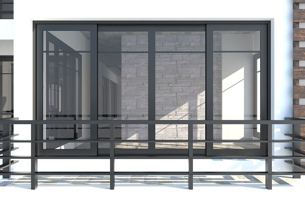 Balcon avec portes coulissantes en verre à cadre sombre et mur de briques grises visible à travers les fenêtres. Garde-corps noir.