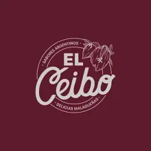Un logotipo para una empresa llamada El Ceibo sobre un fondo granate.