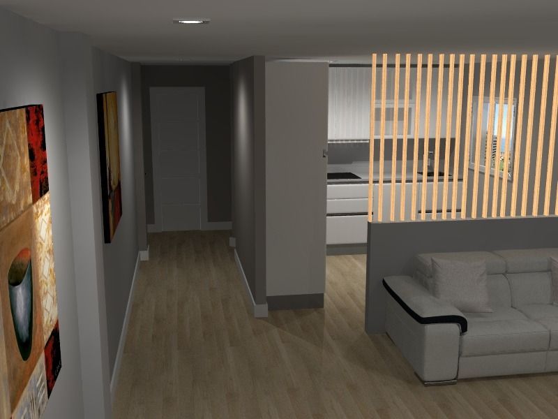 Pasillo con obras de arte que conduce a la cocina y al salón, con un sofá y un divisor de madera.