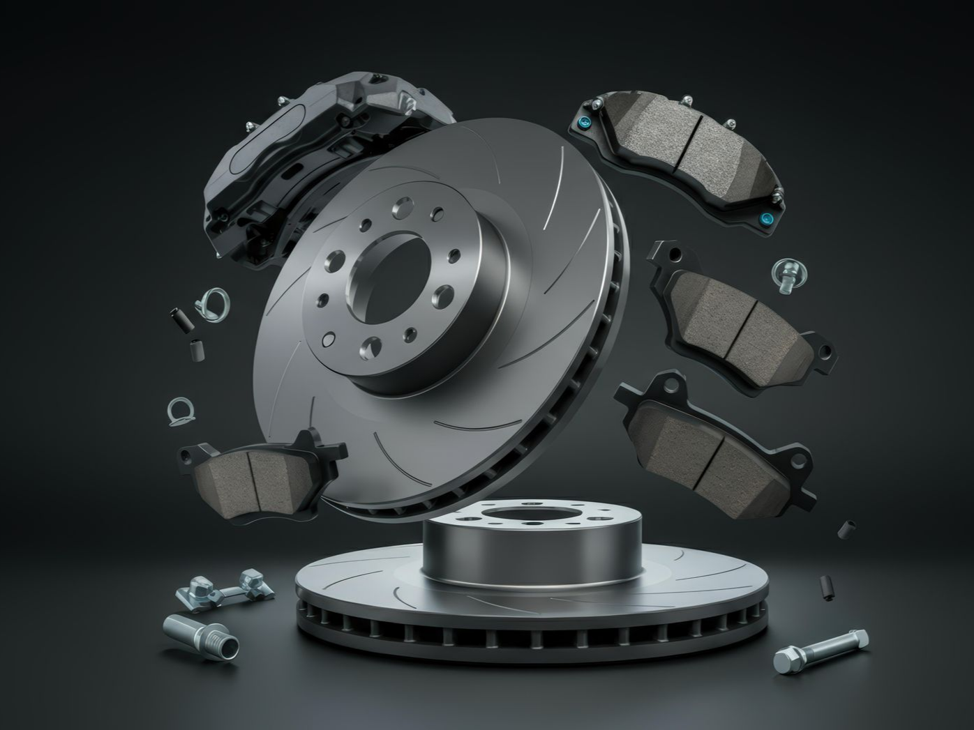 Pièces du disque de frein d'une voiture, comprenant rotor, étrier et plaquettes de frein.