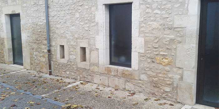 Traitement d'un mur au pistolet contre les remontées capillaires