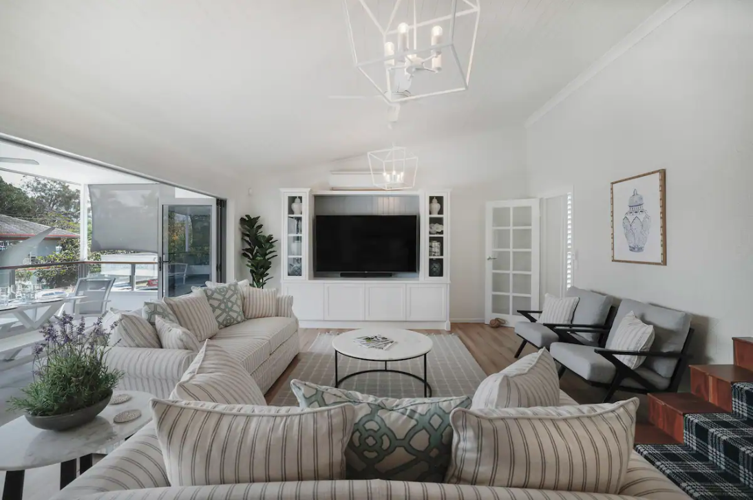 A living room filled with furniture and a flat screen tv.