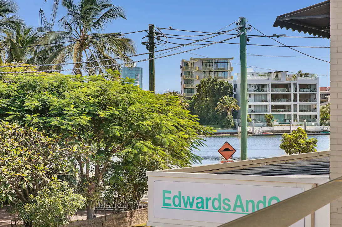 A sign for edwards and associates is on the side of a building.
