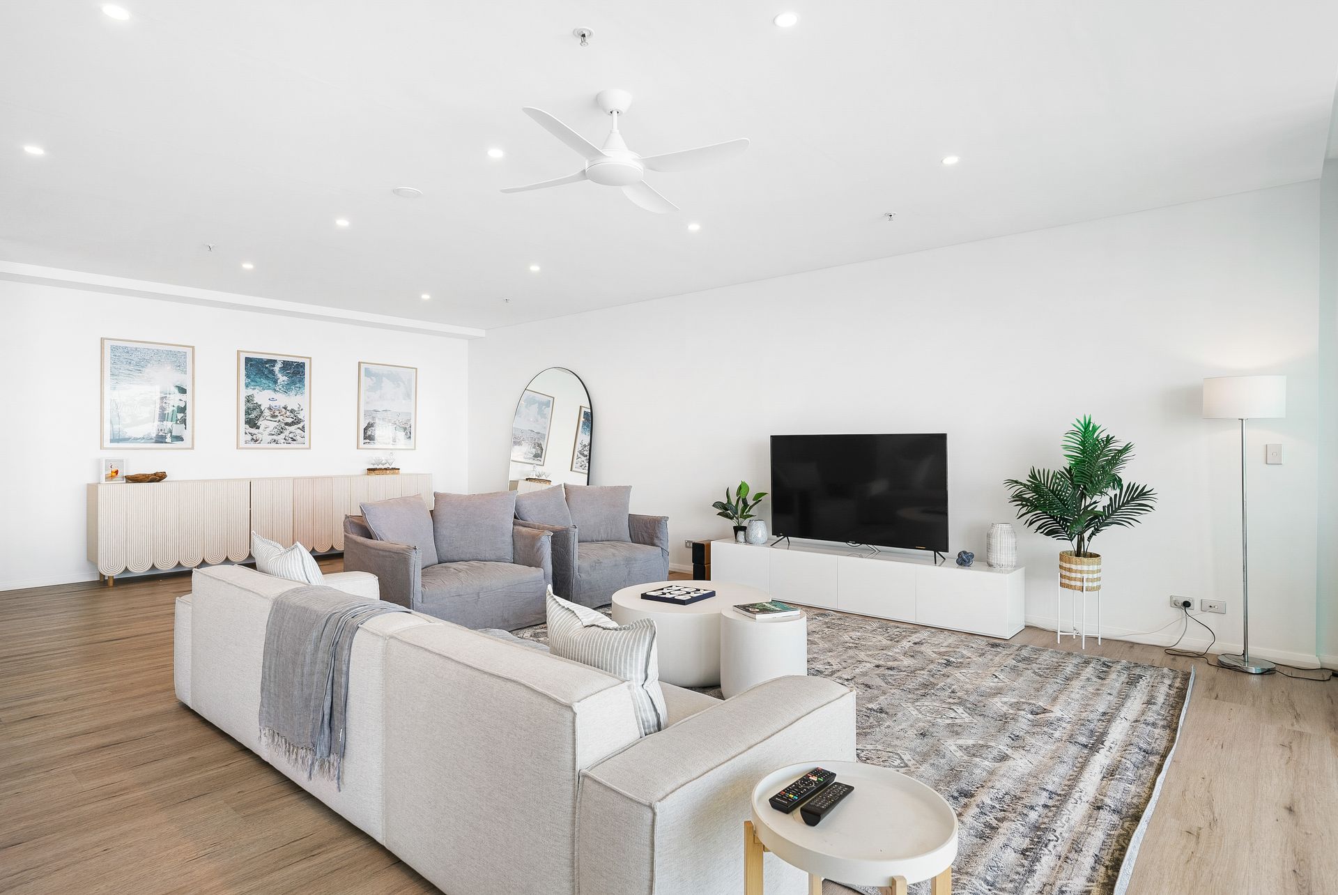 A living room filled with furniture and a flat screen tv.