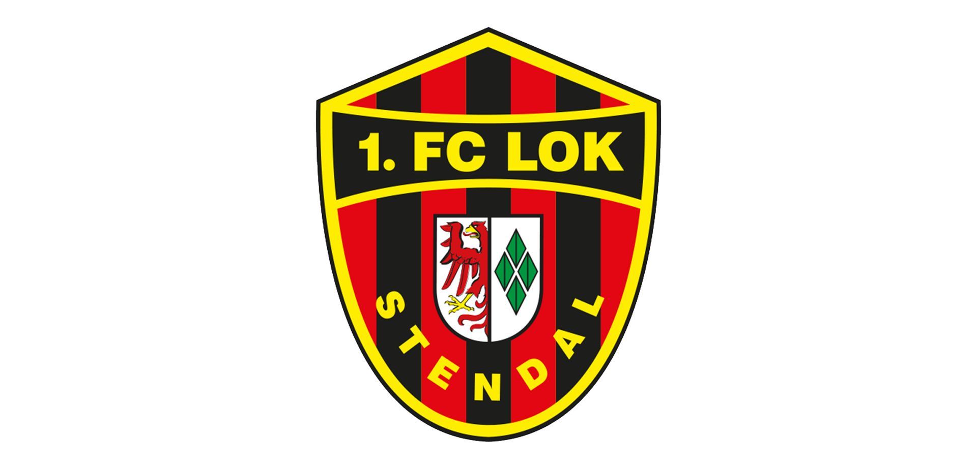 Ein rot-schwarzes Schild mit der Aufschrift „1. FC Lok Stendal“.