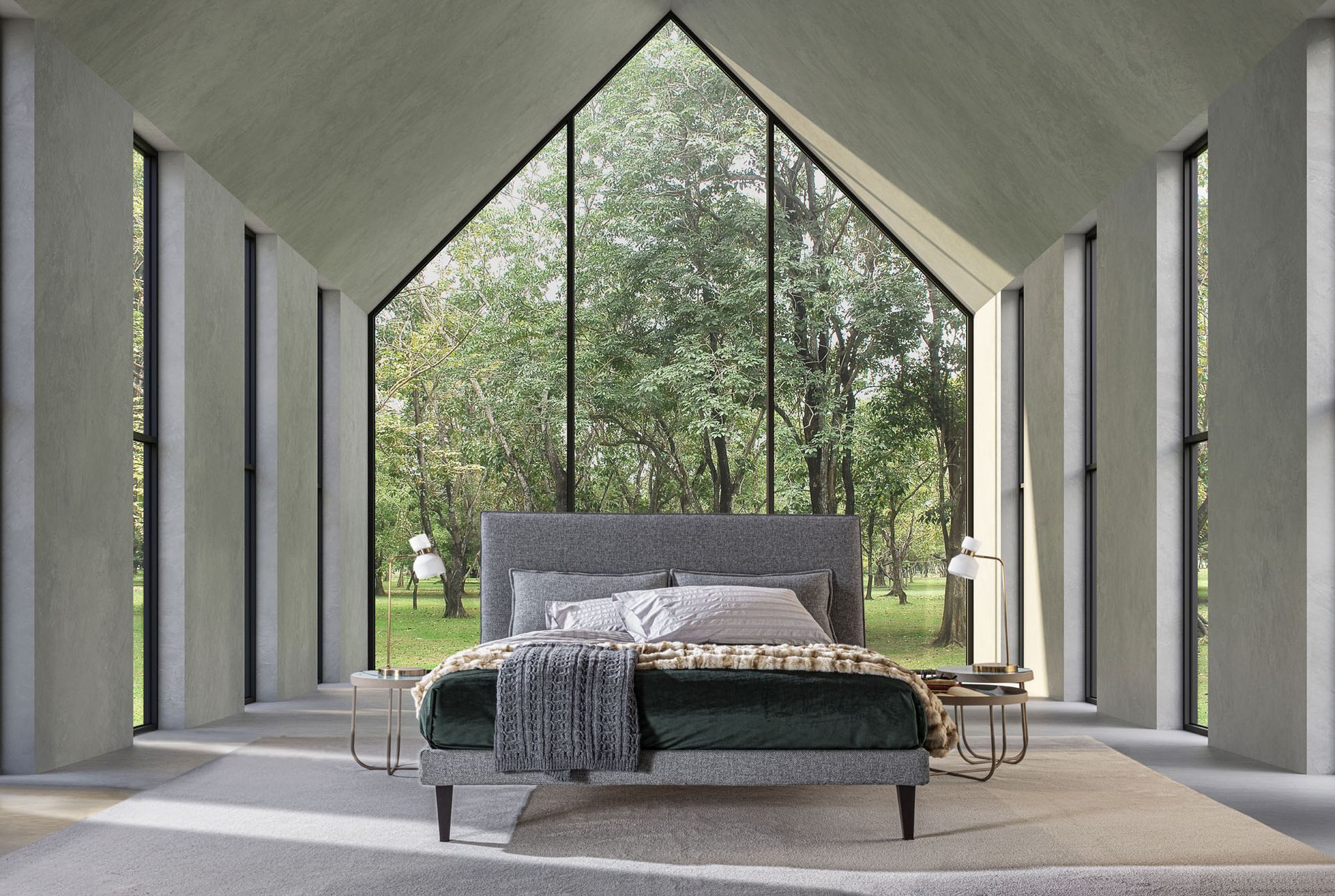 Une personne sur un échafaudage installe un luminaire dans une pièce de style industriel avec des conduits apparents et des suspensions lumineuses.