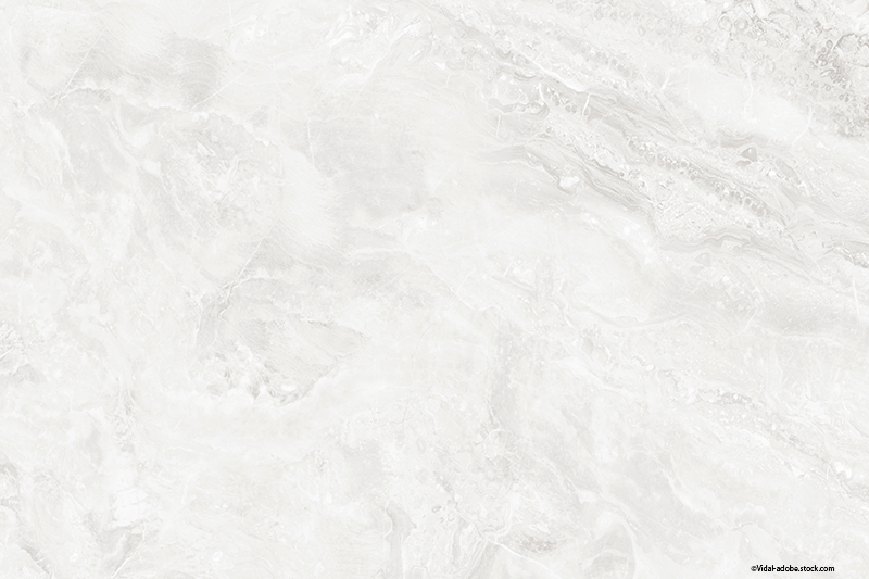 Weiße Marmoroberfläche mit dezenter grauer Maserung.