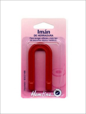 Imán de herradura roja en un paquete, etiquetado "Hemline".