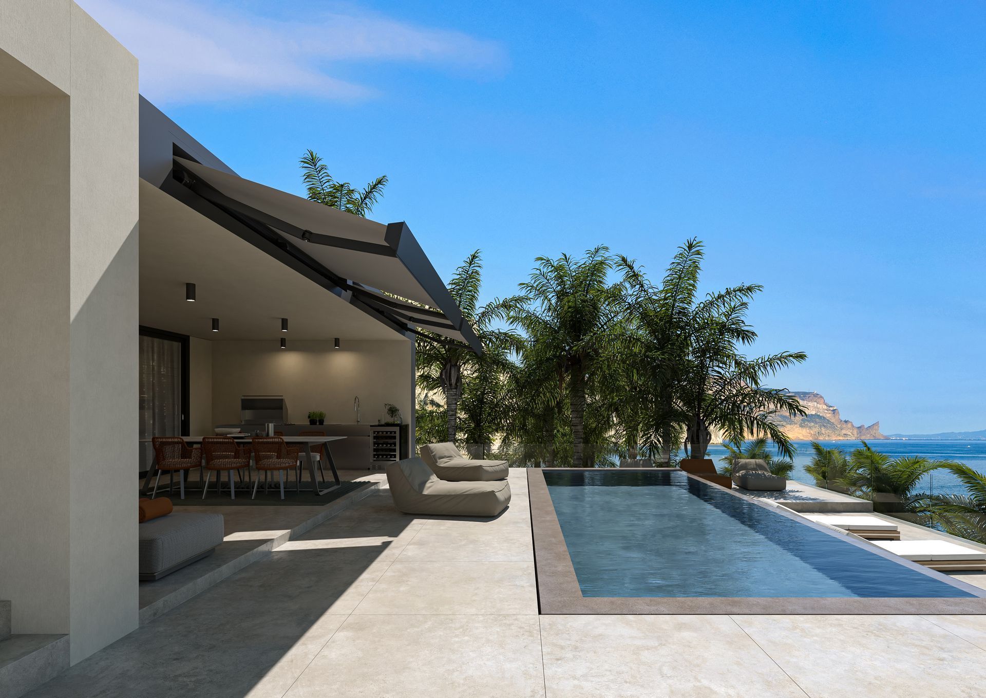 Una moderna terrazza di villa con zona pranzo all'aperto, sdraio e piscina a sfioro rettangolare con vista sul mare.